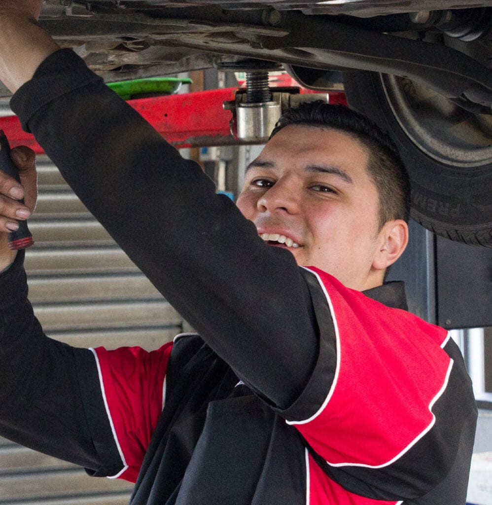 Ultimate Automotive staff member performing car suspension repair