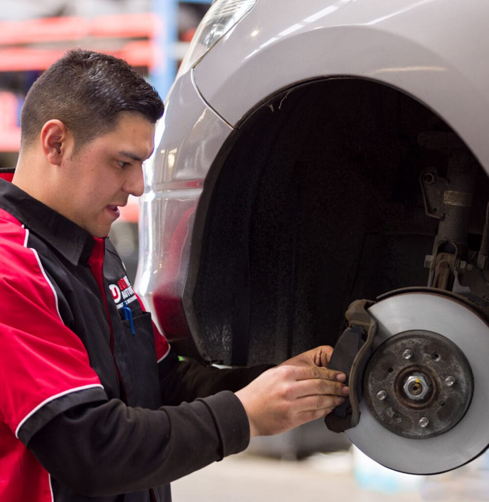 Ultimate Automotive mechanic performing a WOF Hamilton